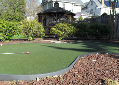 Putting green and screened gazebo